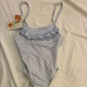 Girl’s striped swimsuit